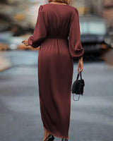 Elegante jurk met lantaarnmouwen en V-hals