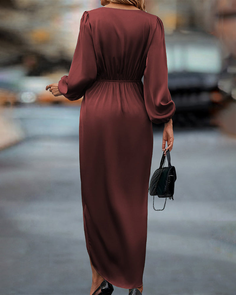 Elegante jurk met lantaarnmouwen en V-hals