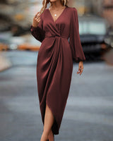 Elegante jurk met lantaarnmouwen en V-hals