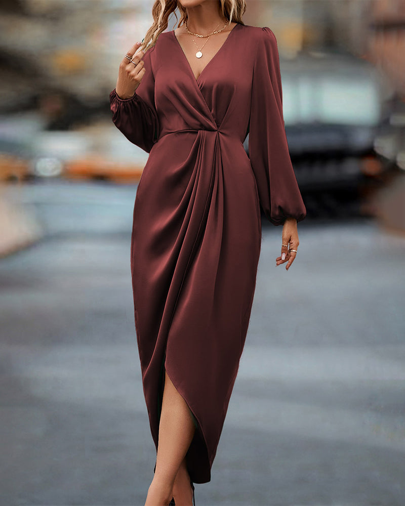 Elegante jurk met lantaarnmouwen en V-hals