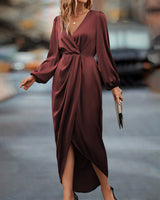 Elegante jurk met lantaarnmouwen en V-hals