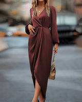 Elegante jurk met lantaarnmouwen en V-hals