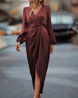Elegante jurk met lantaarnmouwen en V-hals